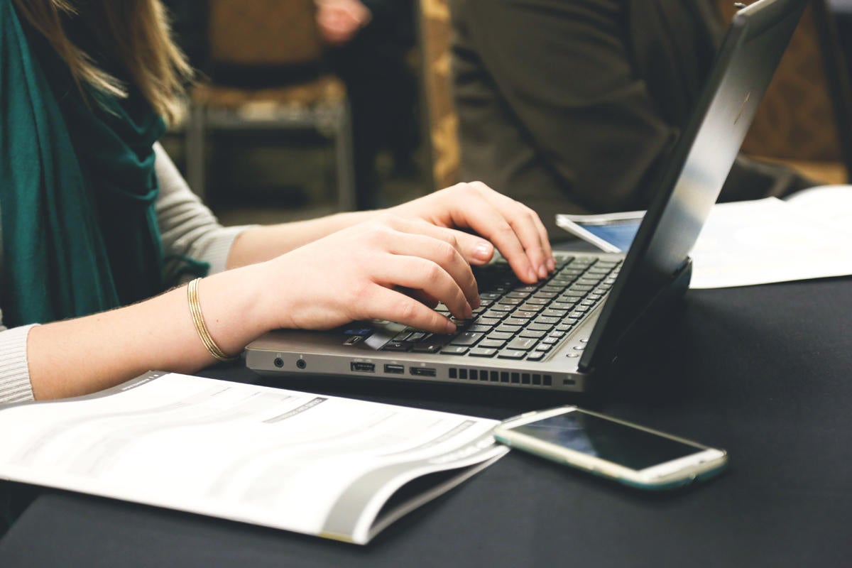 smartphone laptop typing by Startup Stock Photos via Pexels